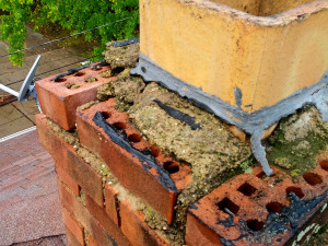 Chimney in severe need of tuck-pointing repair.