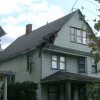 Home with storm damage needing roof repair in Cleveland, OH.