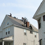 Reader Roofing crew busy installing new roof on East Cleveland home.