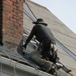 Reader Roofing member working next to chimney.