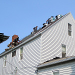 Reader Roofing crew installing new roof.