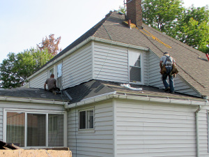 Reader Roofing contractors working on the lower roof.