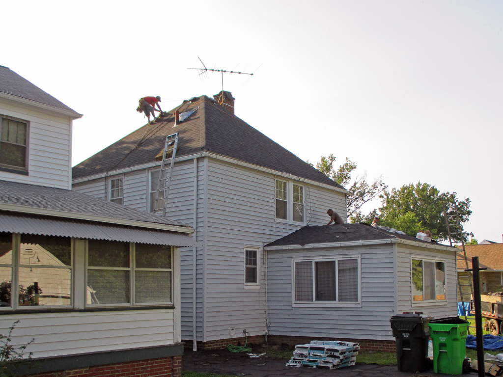 Reader roofing contractors in the process of installing the roof on home in Euclid, OH.